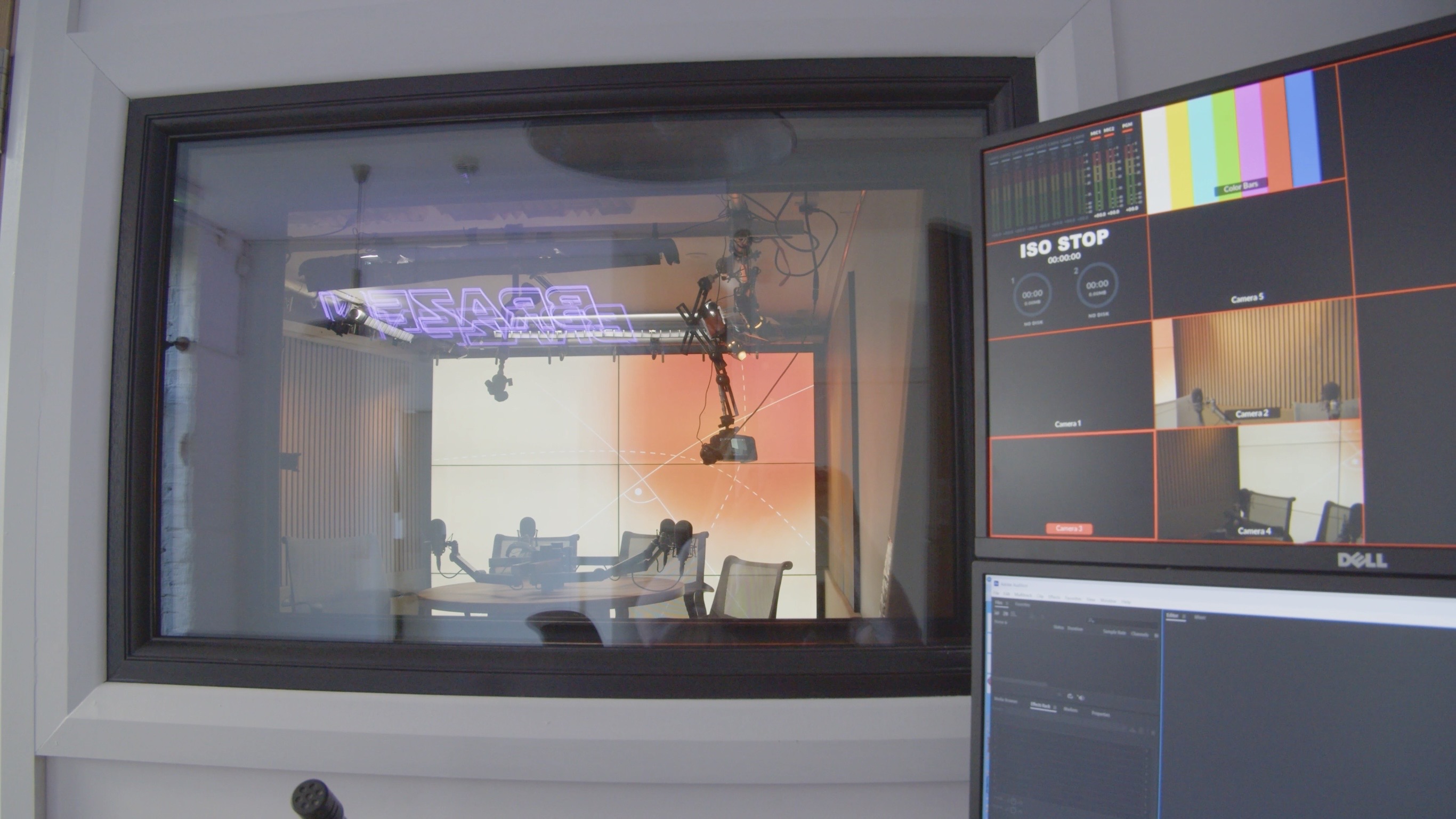 Live monitoring feed showing four Netflix-approved 4K cameras and control room with a peekaboo window into the professional video recording studio built for premium social media content studio output.